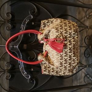 Like new Michael Kors red and tan signature canvas tote